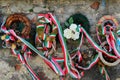 MUKACHEVO, UKRAINE - AUGUST 23 , 2017 , Ribbon with national colours of Hungary tied up to the flower tribute standing near to the