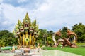 Mukdahan, Thailand - July 31, 2022: 7 Heads of great serpent statues named Srisattanakarat with Two Naga Lovers at Wat Dan Phra In