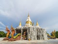 Mukdahan, Thailand - July 31, 2022: Two Nagas at the entrance of the pagoda at Wat Dan Phra In, Nikhom Kham Soi, Mukdahan,