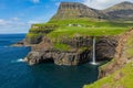 Mulafossur waterfall in Gasadalur village in Faroe Islands, North Atlantic Ocean. Nordic Natural Landscape