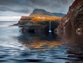 Mulafossur Waterfall reflected in the calm waters of Atlantic Ocean.