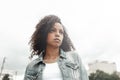 Mulatto black curly girl on street