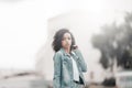 Mulatto black curly girl on street