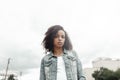 Mulatto black curly girl on street