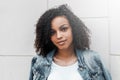 Mulatto black curly girl on street