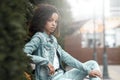 Mulatto black curly girl on street