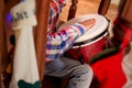 Mulatto child playing percussion drum. Royalty Free Stock Photo