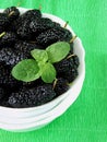 Mulberries on a bright colourful background