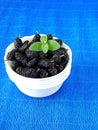 Mulberries in a white bowl