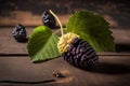 Mulberry isolated on a wooden background. Ripe mulberry fruit. Healthy food from mulberry fruit has a positive effect on health,