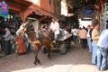 Man driving mule cart through market Royalty Free Stock Photo