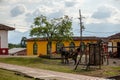 A mule and a horse tied in small town in Colombia