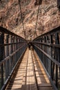 Mule Rider Crossing The Black Bridge At The Bottom Of The Grand Canyon Royalty Free Stock Photo