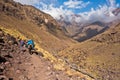 Mule riding on a track in Toubkal National Park at High Atlas mountains, Morocco