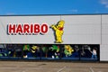 facade of the Haribo Outlet Store with the famous yellow Haribo bear. Haribo is a German confectionery company Royalty Free Stock Photo