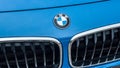 Closeup of BMW Logo on blue car front Royalty Free Stock Photo