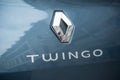 Closeup of Renault Twingo logo on blue rear car parked in the street