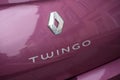 Renault Twingo logo on pink rear car parked in the street