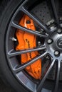 orange brake on mc laren sport car parked in the street Royalty Free Stock Photo