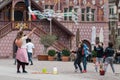 Portrait of woman artiste with soap bubbles in the street on main place