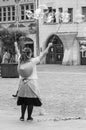 portrait of woman artiste with soap bubbles in the street on main place