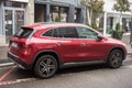 profile view of red mercedes SUV car parked in the street Royalty Free Stock Photo