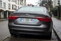 rear view of grey Jaguar XF parked in the street