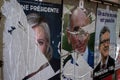 Torn posters by an angry citizen of Marine Le pen and Eric Zemmour candidates for the presidential elections 2022