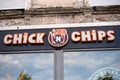 Closeup of chick \'n chips sign on fast food restaurant front in the street