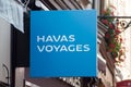 Closeup of Havas voyages sign on travel agency front in the street
