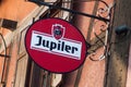 Closeup of Jupiler logo on bar front in the street