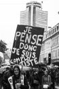 People protesting in the street with banner in french, je pense donc je suis compplotiste, in english, I think I am conspirator Royalty Free Stock Photo