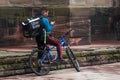 POrtrait of uber eats delivery man in bicycle waiting in the street