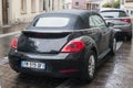 Rear view of black Volkswagen new beetle parked in the street Royalty Free Stock Photo