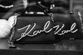 Closeup of black Karl Lagerfeld hand bag in a luxury fashion store showroom