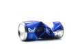 crushed can of blue red bull on white background