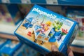 Playmobil toys in a blue box packaging a toys store