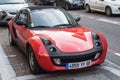 Orange Smart roadster parked in the street Royalty Free Stock Photo