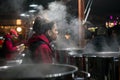 Woman giving mulled wine at the christmas market