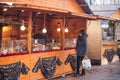 Woman in front of pastry stand at the christmas market