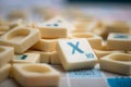 Closeup of plastic letter X on Scrabble board game Royalty Free Stock Photo