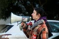 people protesting in the street agaisnt the pensioners reform with megaphone