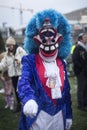 Portrait of masked people parading in the street