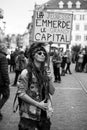 portrait of punk girl protesting with placard in french : la jeunesse emmerde le grand