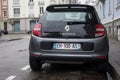 rear view of grey Renault Twingo 3 parked in the street by rainy day Royalty Free Stock Photo