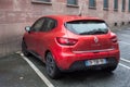rear view red Renault Clio parked in the street
