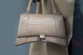 Closeup of brown leather hand bag by balenciaga in a luxury fashion store showroom