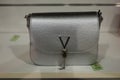 Grey leather hand bag by Valentino in a luxury fashin store showroom