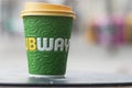 Cup of coffee from subway brand abandonned in the street - subway is the american famous brand of fast food si