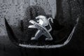 Mulhouse - France - 31 January 2021 - Closeyp of rain drops on the lion logo of black peugeot front car parked in the street